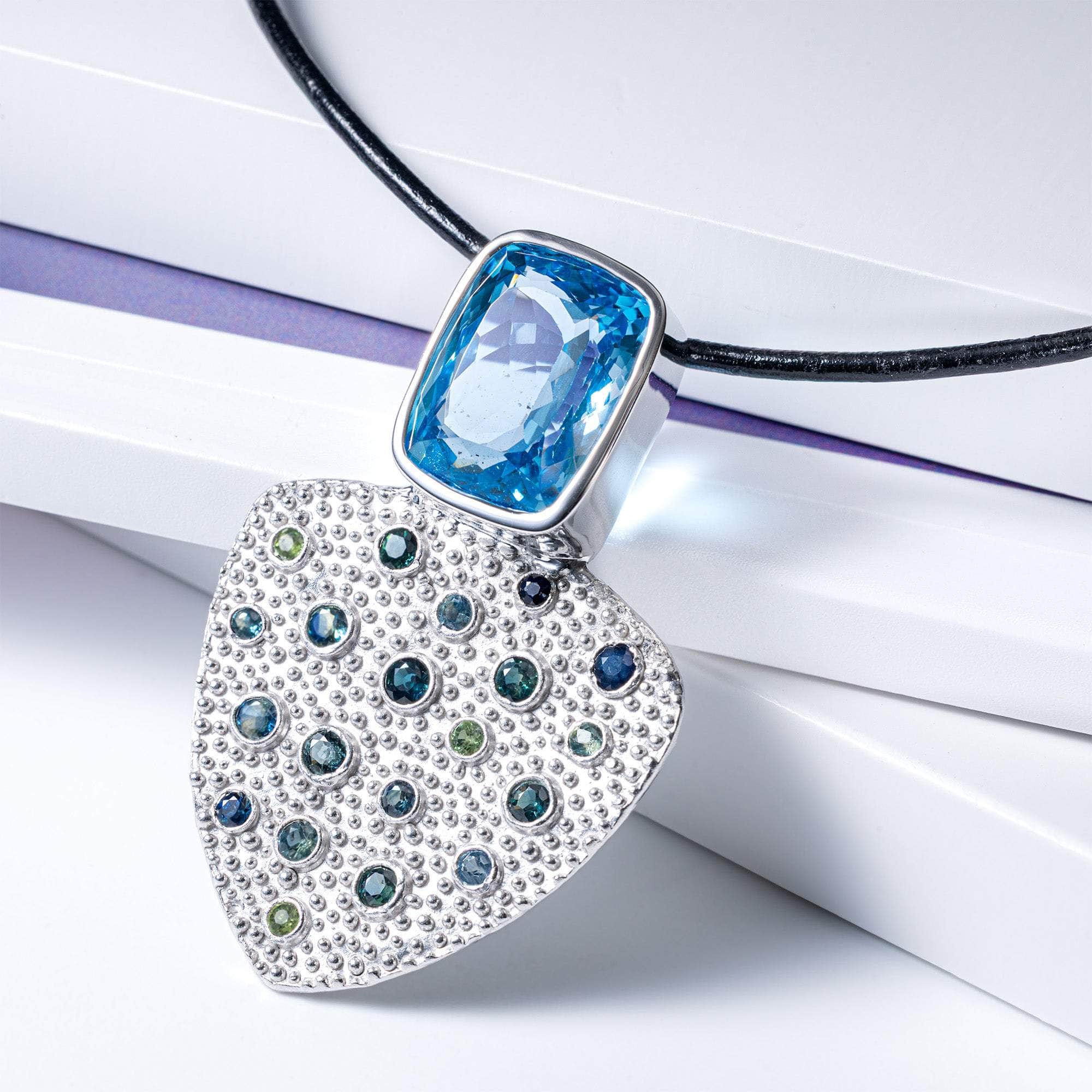 Morrigan One of a Kind Pendant in White Rhodium Plated Sterling Silver with Blue Topaz and Blue and Green Sapphires