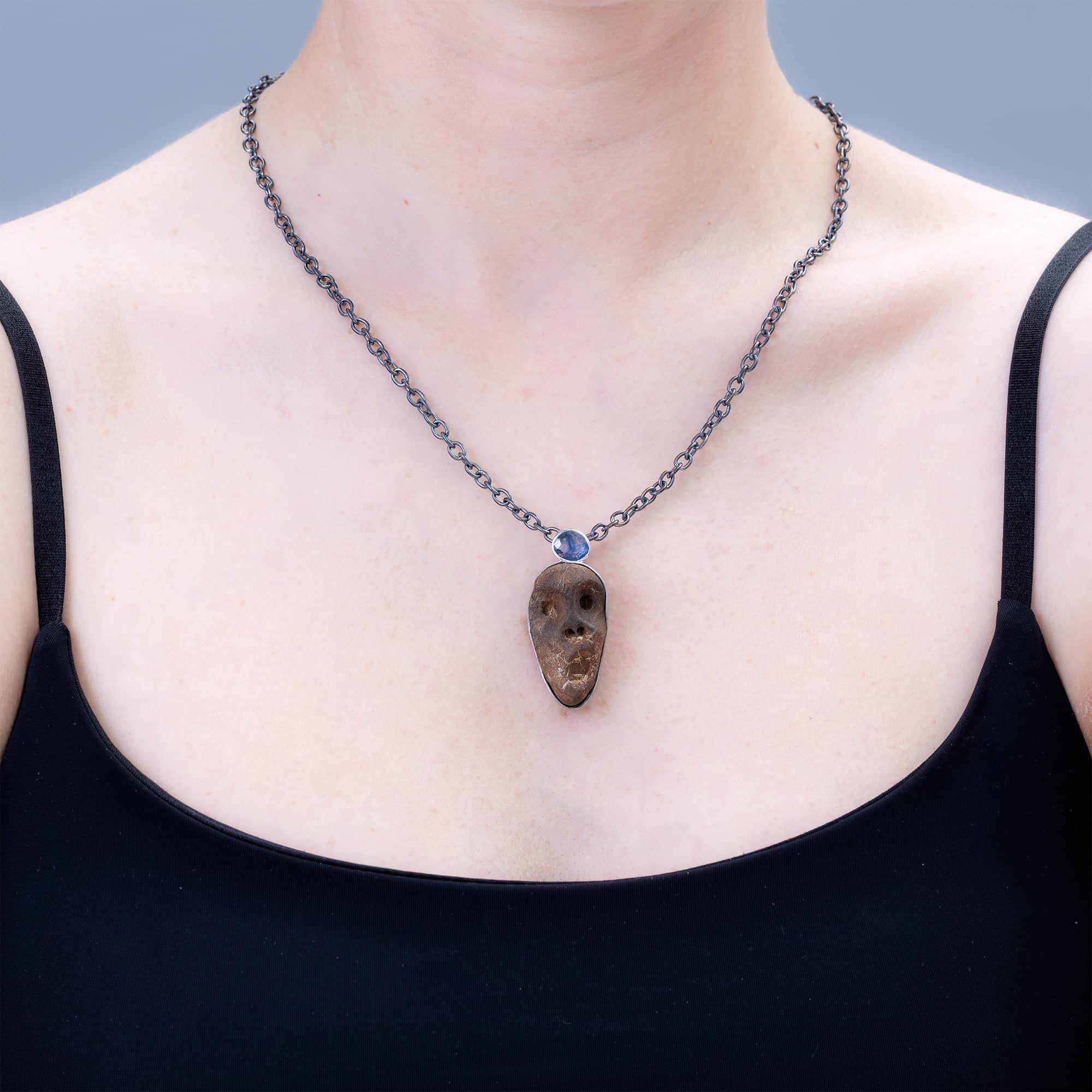 Manes Sterling Silver Pendant with Ancient Mediterranean Limestone Maskette & Natural Blue Sapphire