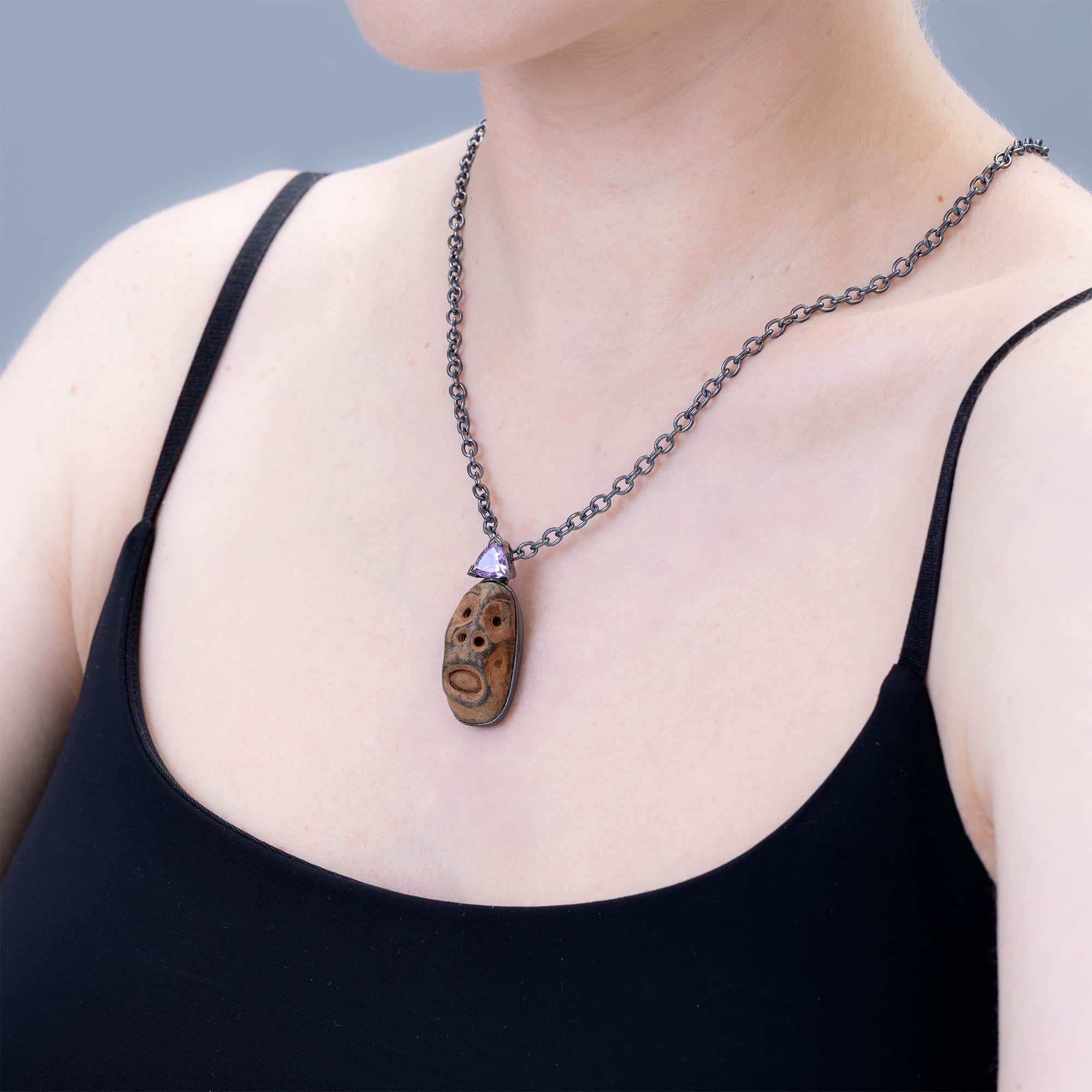 Chaos Sterling Silver Pendant with Ancient Mediterranean Limestone Maskette & Natural Trillion Amethyst
