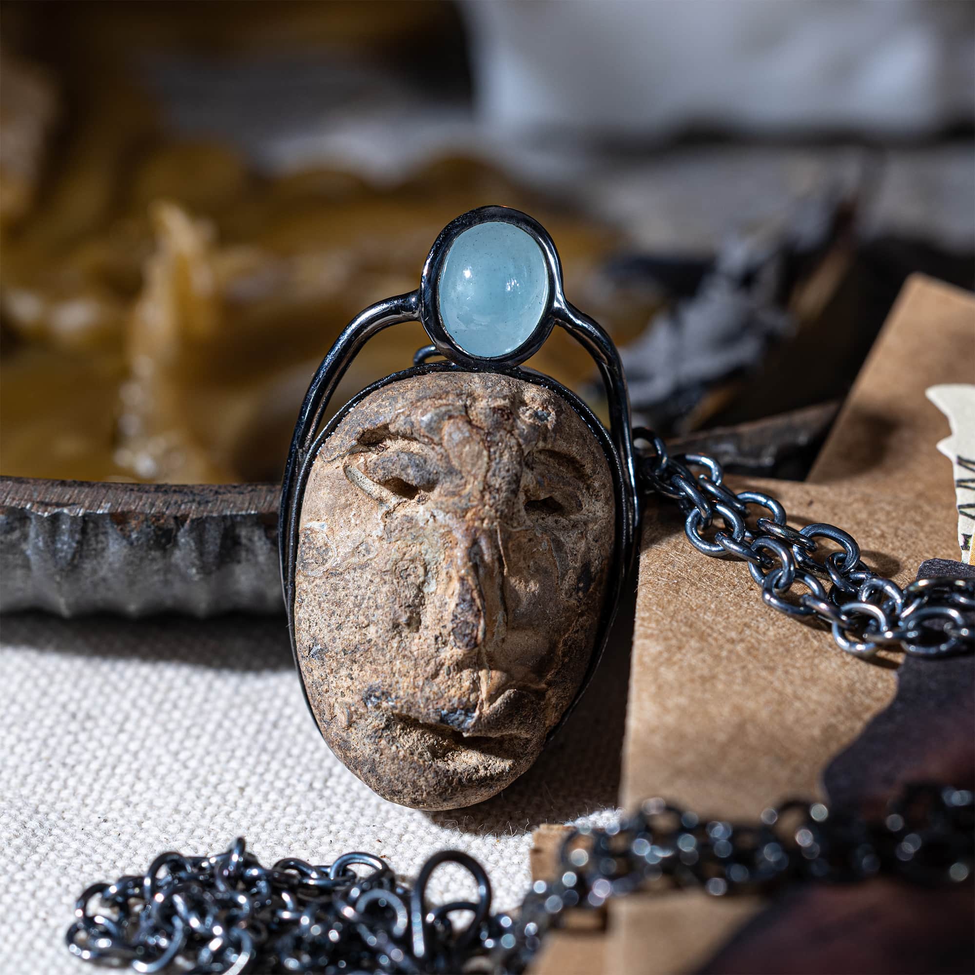 Strix Sterling Silver Pendant with Ancient Mediterranean Limestone Maskette & Oval Aquamarine
