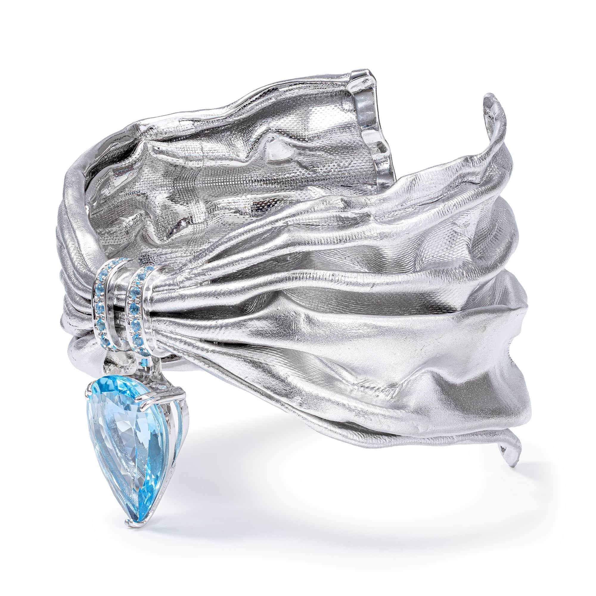 Aegle Silver Bracelet with Blue Topaz and Textured Fabric-Like Surface