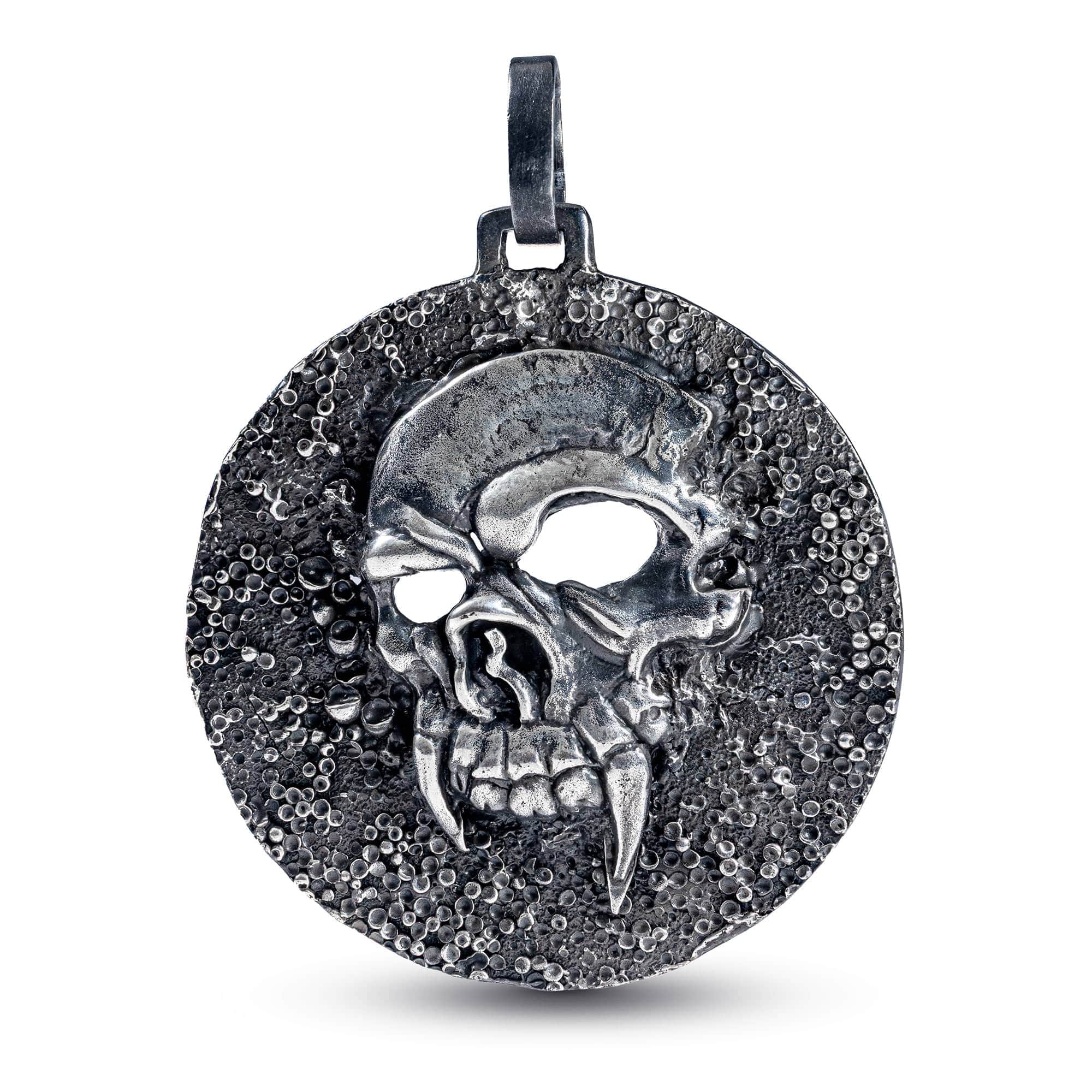 Helm Oxidized Silver Skull Pendant on Dark Textured Surface