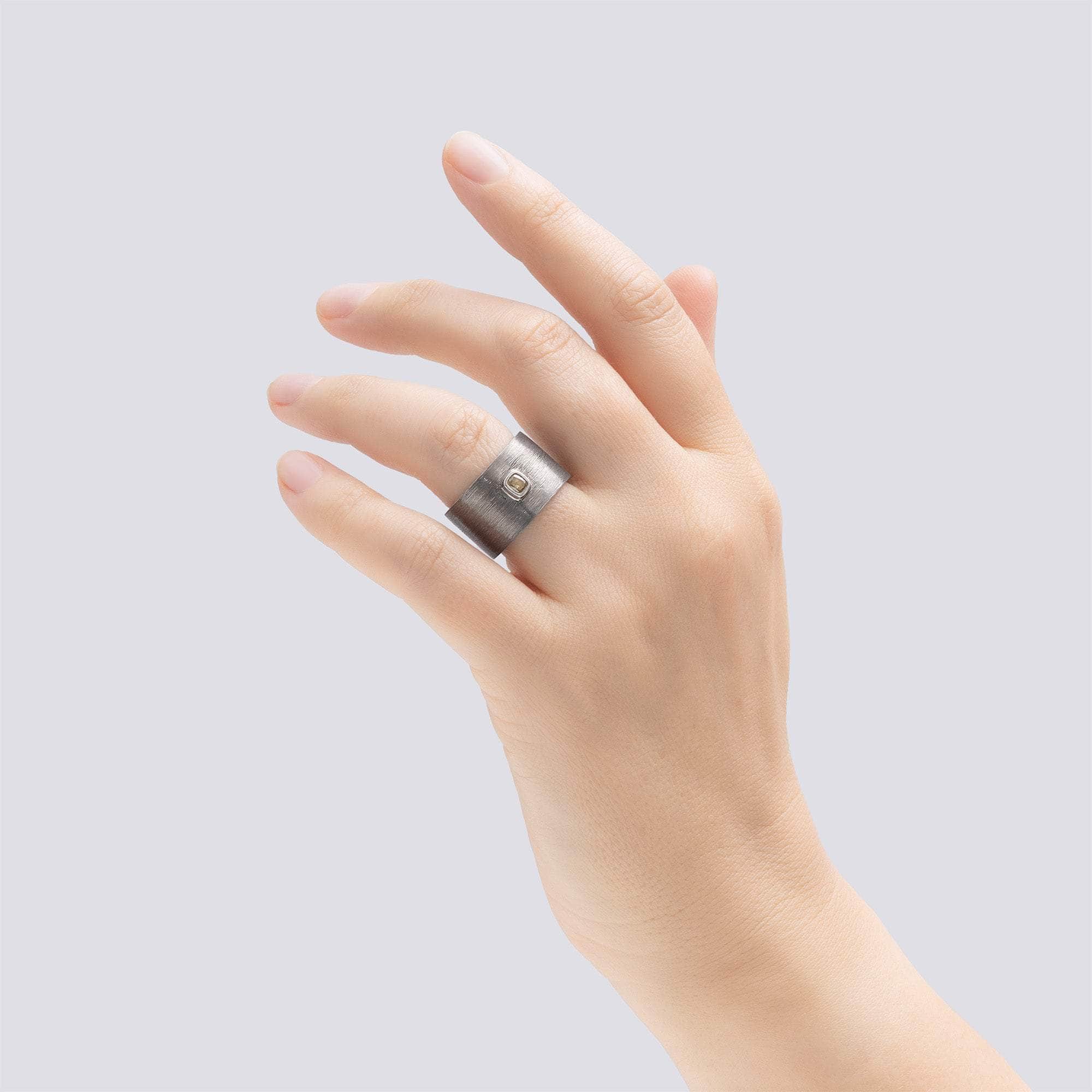 Intra Singular Statement Ring with 0.20 Carat Golden Olive Diamond & Hidden Round Cabochon Rubies Inside