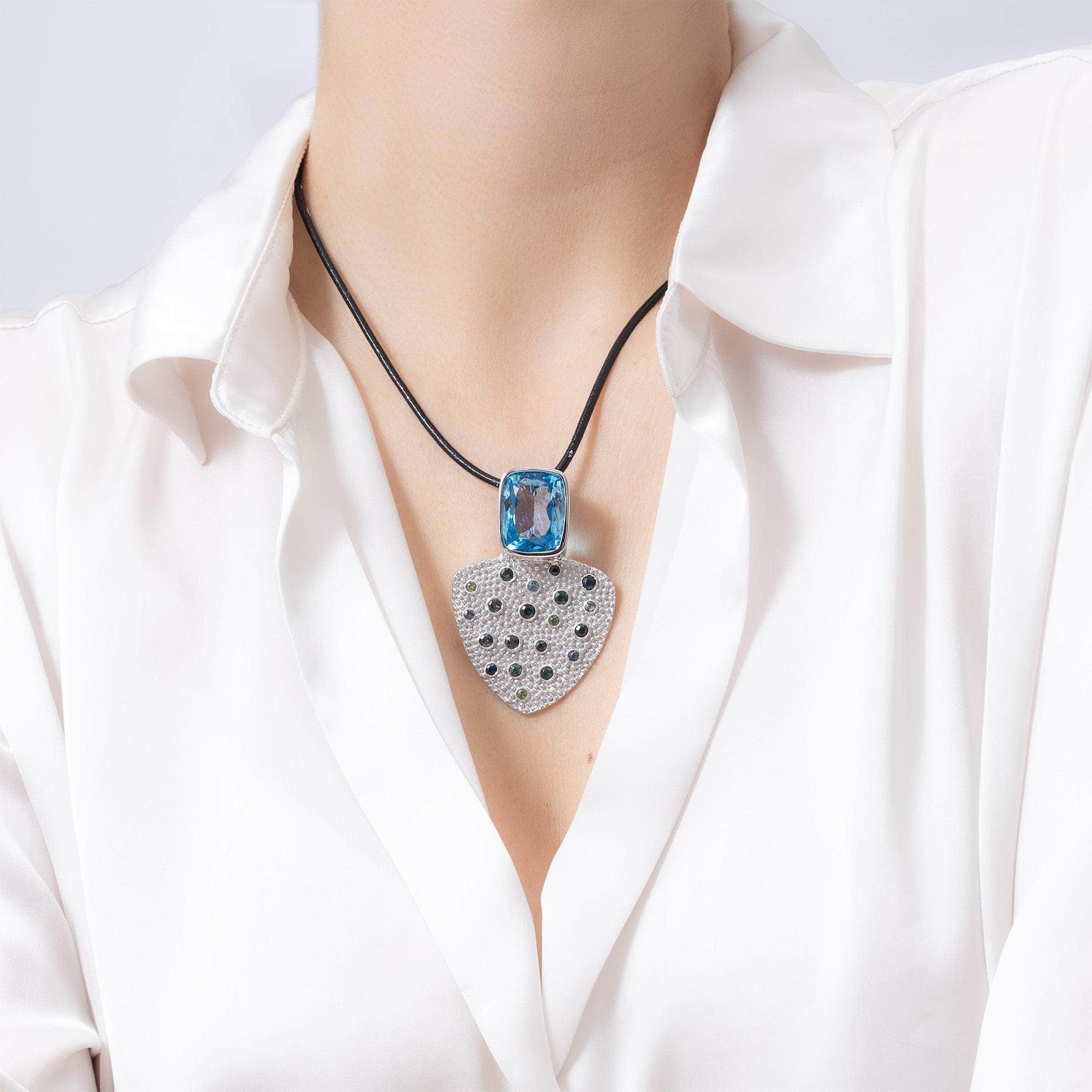 Morrigan One of a Kind Pendant in White Rhodium Plated Sterling Silver with Blue Topaz and Blue and Green Sapphires