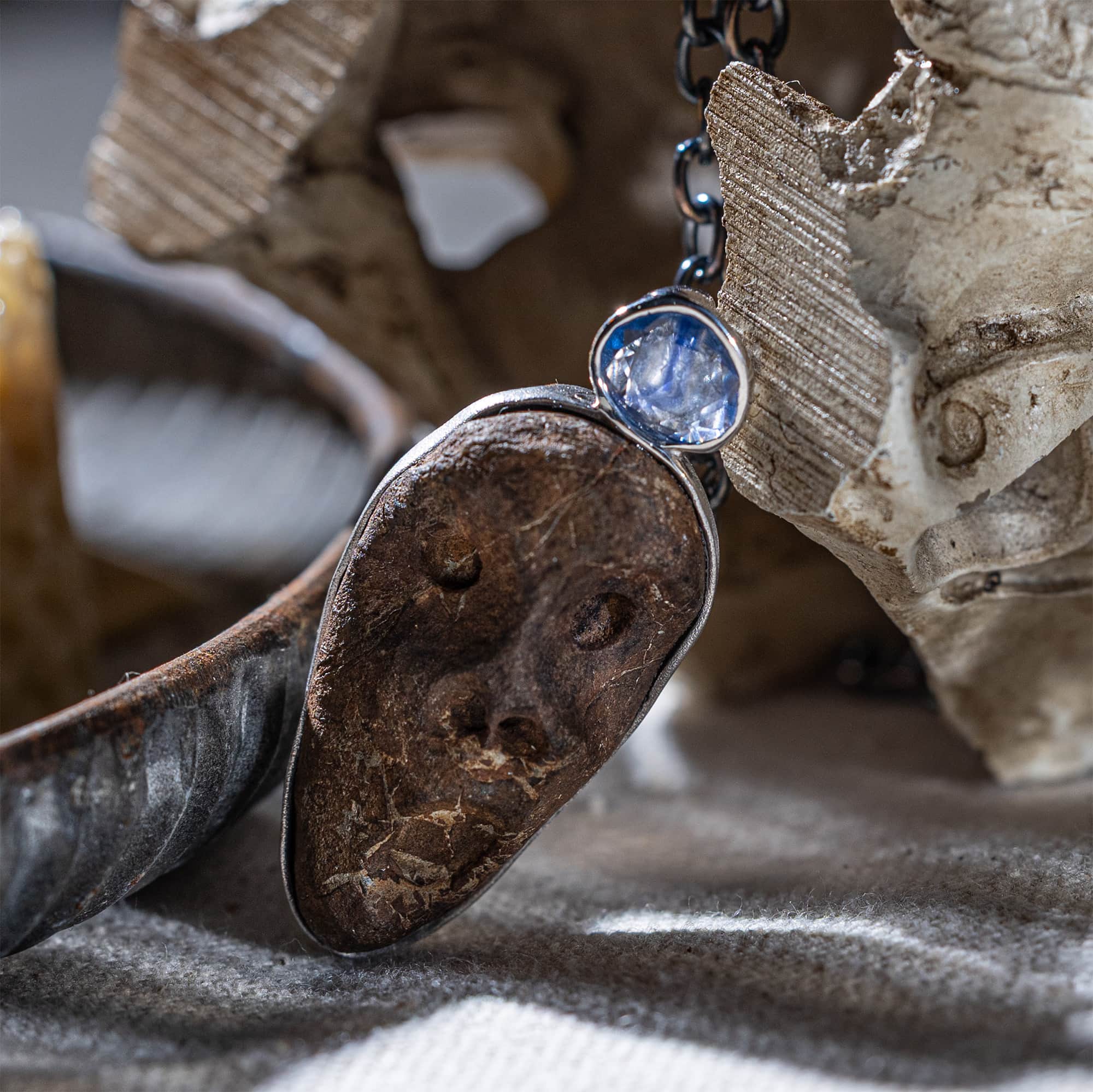 Manes Sterling Silver Pendant with Ancient Mediterranean Limestone Maskette & Natural Blue Sapphire