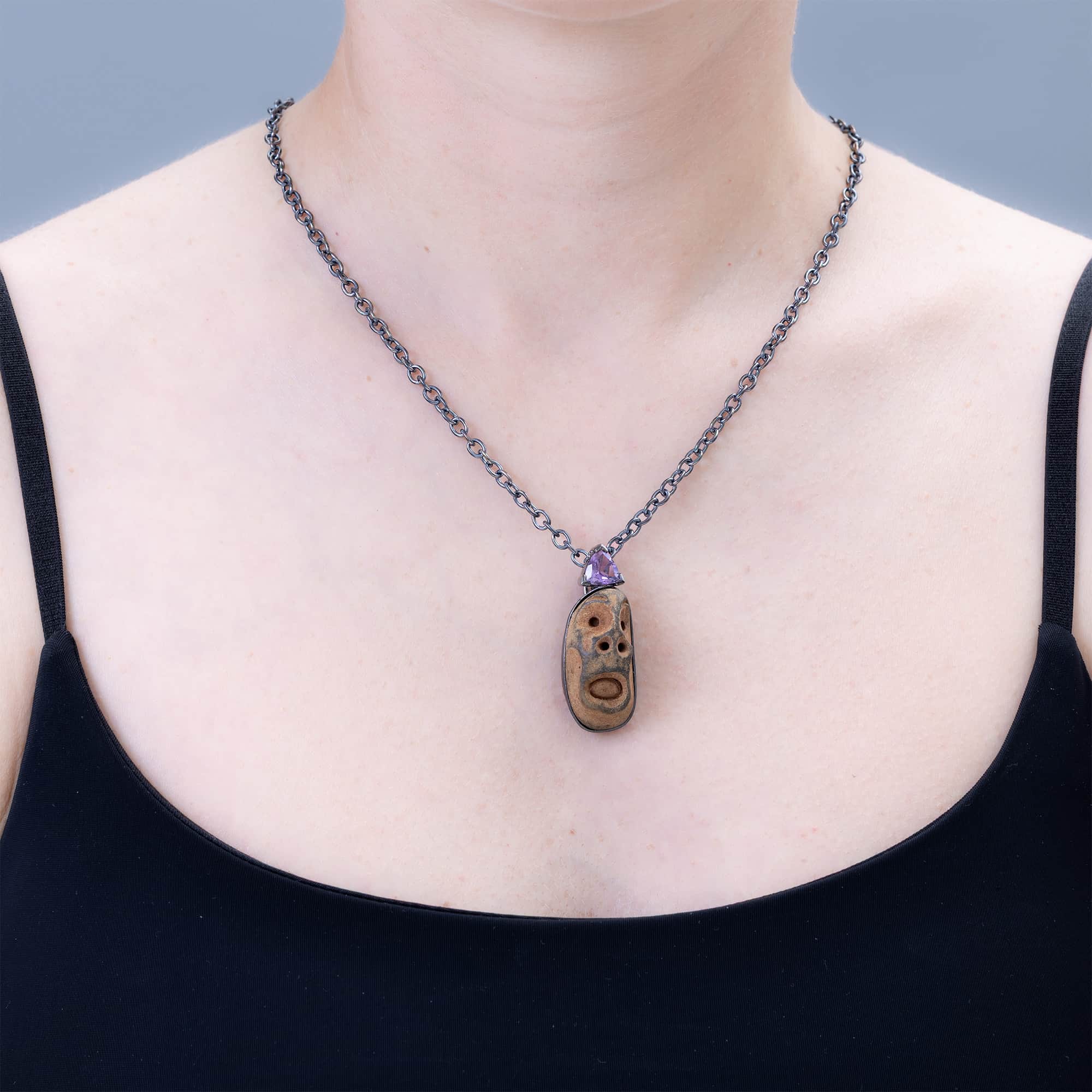 Chaos Sterling Silver Pendant with Ancient Mediterranean Limestone Maskette & Natural Trillion Amethyst