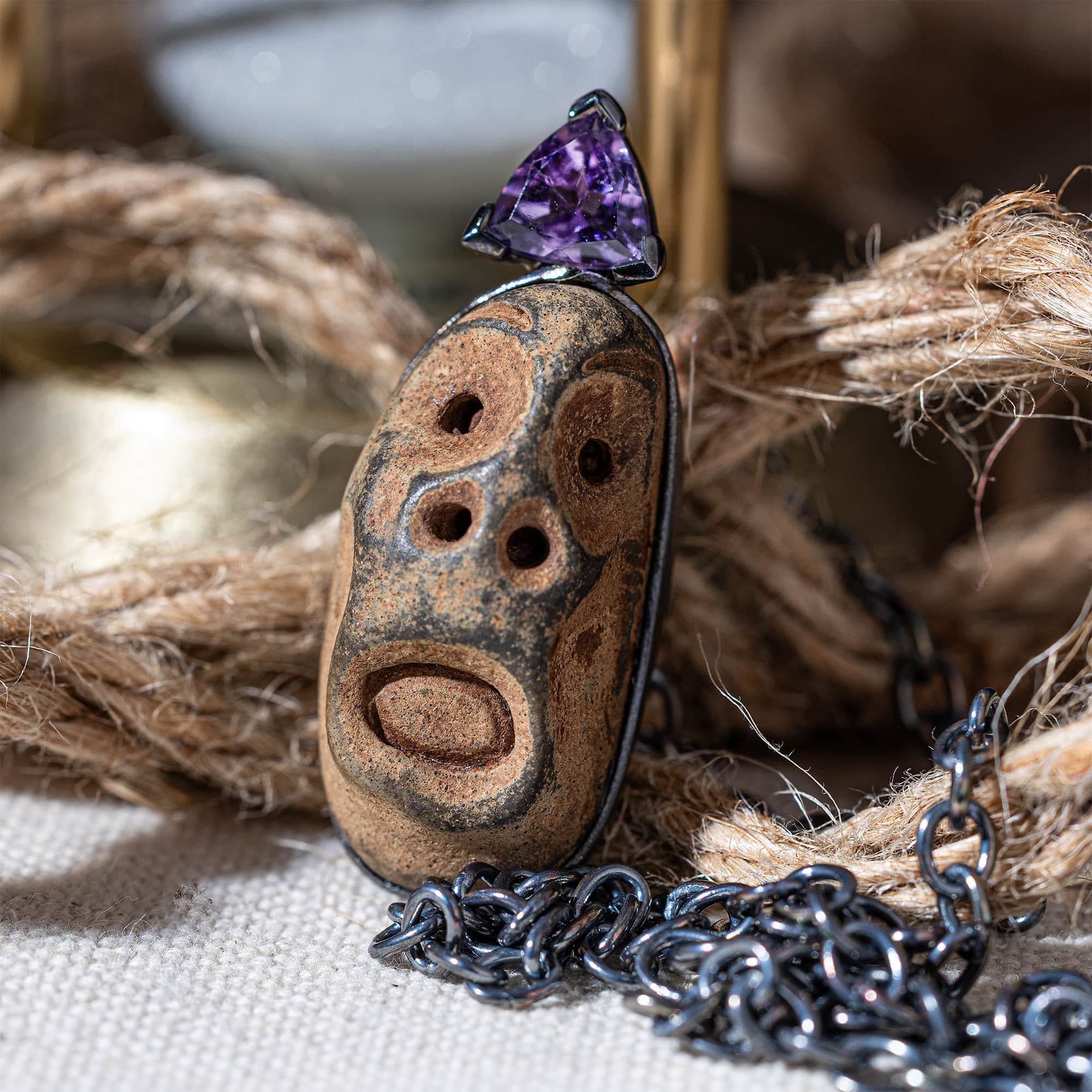 Chaos Sterling Silver Pendant with Ancient Mediterranean Limestone Maskette & Natural Trillion Amethyst