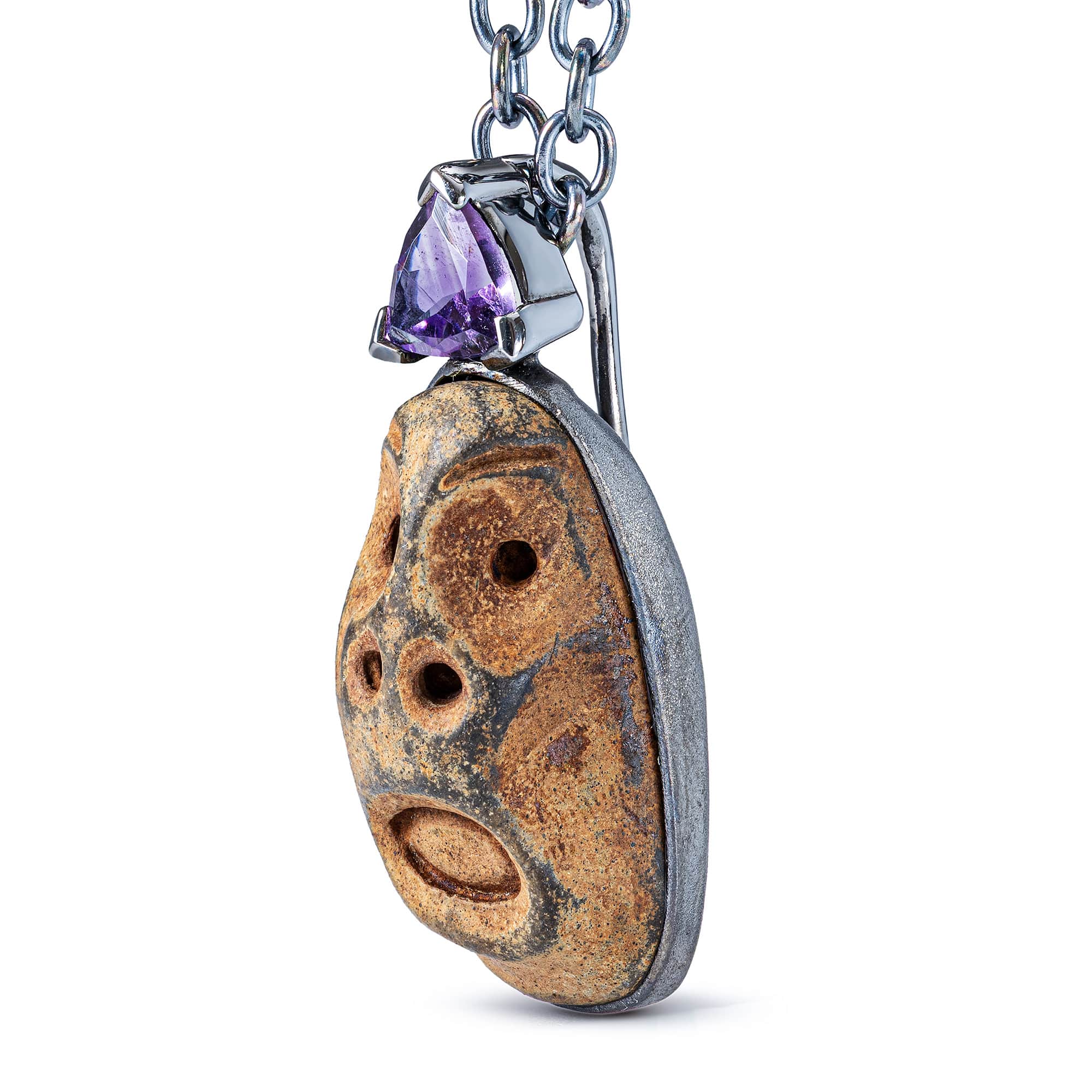 Chaos Sterling Silver Pendant with Ancient Mediterranean Limestone Maskette & Natural Trillion Amethyst