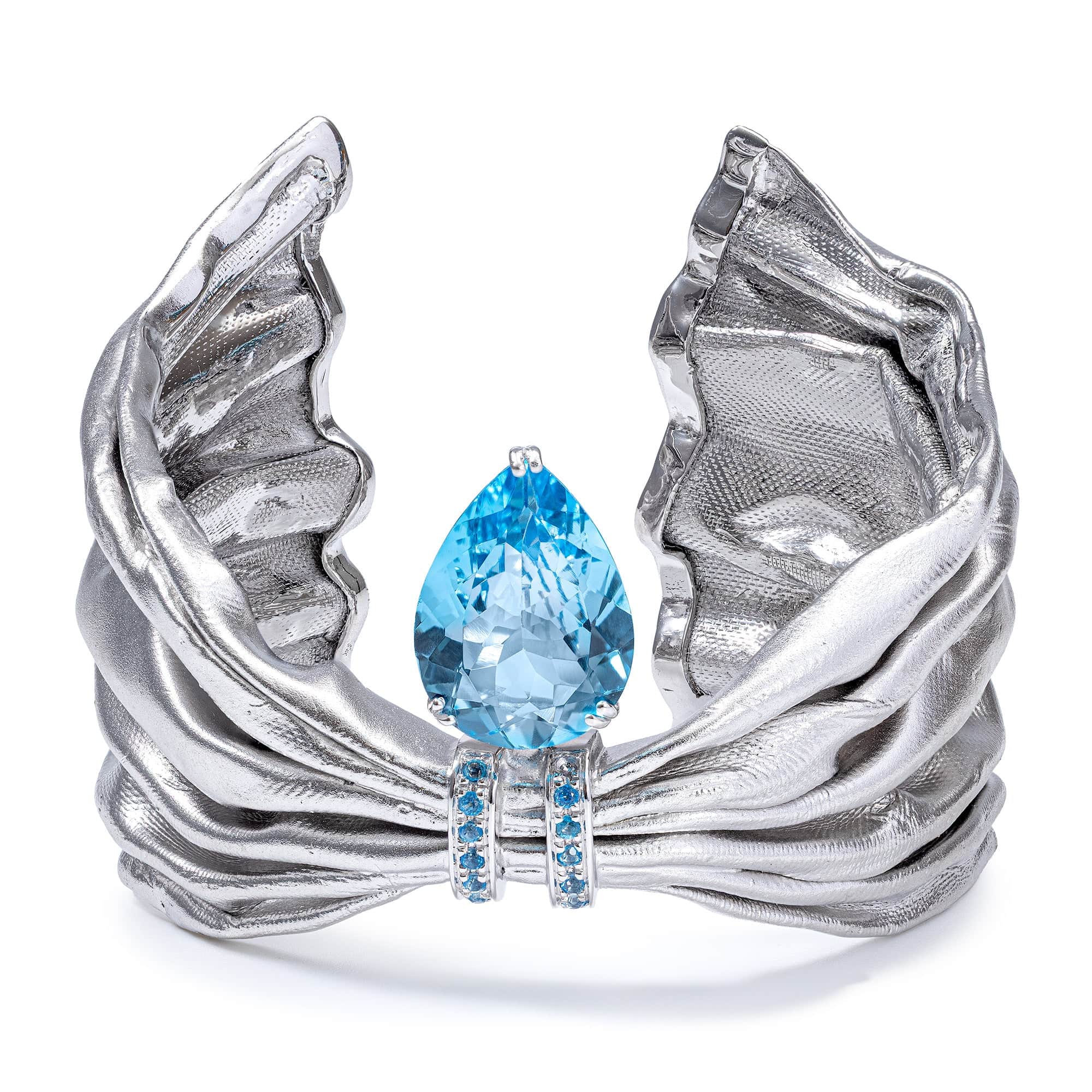 Aegle Silver Bracelet with Blue Topaz and Textured Fabric-Like Surface